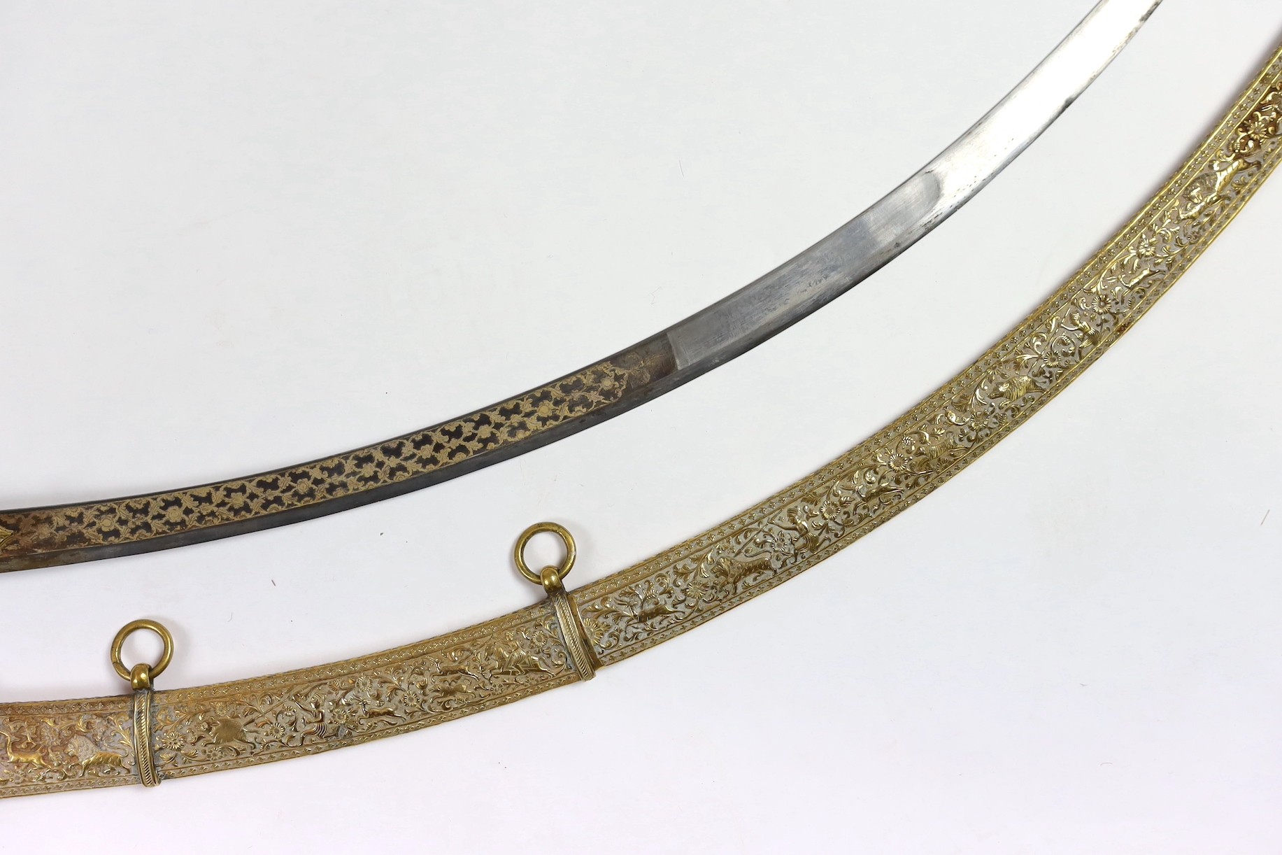 A fine Indian gilt copper and paste mounted sword (shamshir), Kutch, 19th century, sword 79cm long, scabbard 75cm long